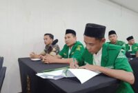 Foto Ketua PC GP Ansor Bolmut, Sahabat Agung Aditya Saenong (Tengah), Sekretaris Kamil Buhohang (Kanan) dan Kasatkorcab Banser Bolmut Fais Tunggil