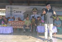 Bupati Boltara Dr. Sirajudin Lasena saat memberikan sambutan di giat Government Care Kecamatan Pinogaluman