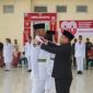 Bupati Boltara Dr. Sirajudin Lasena saat kukuhkan pasukan Paskibraka tahun 2025