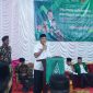 Wakil Bupati Boltara Moh. Aditya Pontoh saat membuka kegiatan PKL dan Susbalan GP Ansor Gedung Olahraga Desa Talaga Tomoagu