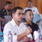 Bupati Boltara, Dr. Sirajudin Lasena saat memberikan sambutan di rapat kerja pemda bersama pemerintah kecamatan dan desa se-kecamatan pinogaluman