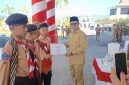 Bupati Boltara Sirajudin Lasena menyerahkan Piagam penghargaan pada Kontingen Jamnas XII 2026